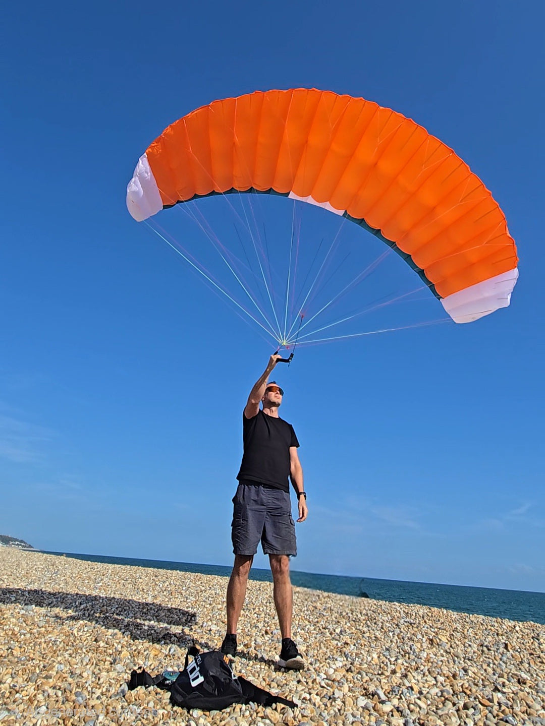 PPC Orbit parawing a man holding in the air